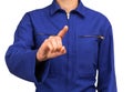 Woman in blue work uniform touching or pointing at something with his finger Royalty Free Stock Photo