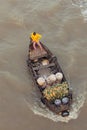 Woman on boat floating down Mekong river , Vietnam Royalty Free Stock Photo