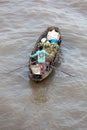 Woman on boat floating down Mekong river , Vietnam Royalty Free Stock Photo