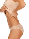 Woman body in beige cotton undrewear