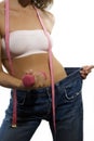 Woman body in jeans with tape-line and pink dumbll Royalty Free Stock Photo