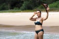 Woman body pretty with bikini hat and wave on beach