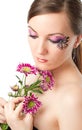 Woman with bodyart butterfly on face with flower Royalty Free Stock Photo
