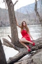 Woman in a bold red dress like a little red riding hood Royalty Free Stock Photo