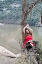 Woman in a bold red dress like a little red riding hood Royalty Free Stock Photo