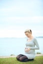 Woman bonding with unborn child Royalty Free Stock Photo