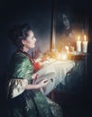 Woman with book in retro dress and ghost in the mirror