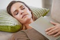 Woman, book and sofa sleeping in home for weekend nap in living room for wellness, holiday vacation or calm. Female Royalty Free Stock Photo