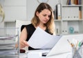 Woman bookkeeper doing paperwork in office Royalty Free Stock Photo
