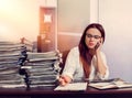 Woman bookkeeper using mobile phone at workplace Royalty Free Stock Photo