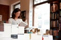 Woman, books and reading in a store, library or bookstore customer and choosing a novel to buy, read or study. Girl Royalty Free Stock Photo