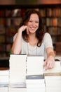 Woman, bookstore business owner and happy in portrait by stack for discount, sale or pride for promotion. Entrepreneur Royalty Free Stock Photo