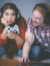 Woman is bored while man playing games