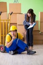The woman boss and man contractor working with boxes delivery Royalty Free Stock Photo