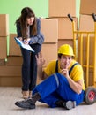 Woman boss and man contractor working with boxes delivery Royalty Free Stock Photo