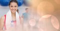 Woman with bottle and towel and peach bokeh transition Royalty Free Stock Photo