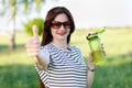 A woman with a bottle of water in her hands Royalty Free Stock Photo