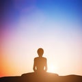 Woman in bound angle yoga pose meditating at sunset. Zen Royalty Free Stock Photo