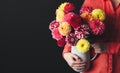Woman with bouquet of beautiful dahlia flowers on black background, closeup. Space for text Royalty Free Stock Photo