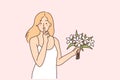 Woman with bouquet of flowers makes shh gesture with finger to lips, wanting to surprise loved one