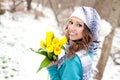 Woman with a bouquet of flowers at the park