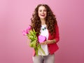 woman with a bouquet of tulips and a heart shaped box of chocolates Royalty Free Stock Photo