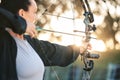 Woman, bow or arrows aim in sports field, shooting range or gaming ground for hunting, hobby or performance exercise Royalty Free Stock Photo