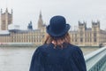 Woman with bowler hat at hopuses of parliament Royalty Free Stock Photo