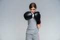 Woman Boxer In Gloves Training On GrayBackground.