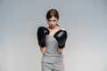 Woman Boxer In Gloves Training On GrayBackground.