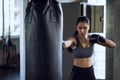 Woman boxer punch punching bag at gym Royalty Free Stock Photo