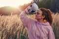 Woman boxer trains sports on the background of the autumn forest, sunset in the park