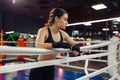 Woman in boxing bandages at the ropes on ring Royalty Free Stock Photo