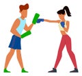 Woman boxing in gloves with combat instructor. Fight training