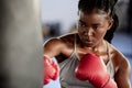 Woman, boxing and gym training workout for strong and motivated athlete fighter fitness. Hand coordination, focus and