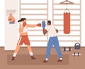 Woman boxing with trainer in gym. Box coach with handheld pad and boxer punching in it with fist in glove. Workout of