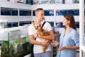 Woman and a boy discuss of aquarium fish Royalty Free Stock Photo