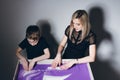 Woman and a boy draw on an interactive sand table Royalty Free Stock Photo