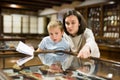 Woman and boy exploring artworks in museum