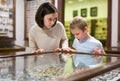 Woman and boy exploring artworks in museum