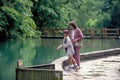 Woman and Boy Feed Fish