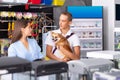 Woman and boy with interest looking at aquarium in pet shop Royalty Free Stock Photo