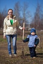 Woman with boy planting tree Royalty Free Stock Photo