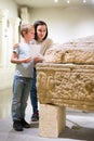 Woman and boy visiting sculptures exhibition