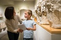 Woman and boy visiting sculptures exhibition Royalty Free Stock Photo