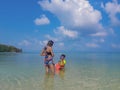 Woman and boy wearing a life jacket, scuba diving in the sea. Royalty Free Stock Photo