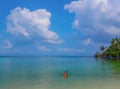 Woman and boy wearing a life jacket, scuba diving in the sea. Royalty Free Stock Photo