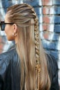 Woman with braid with golden safety pins and chain before Fendi fashion show, Milan Fashion Royalty Free Stock Photo