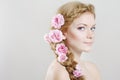 Woman with with braids and roses in hair Royalty Free Stock Photo