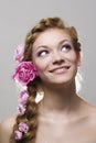 Woman with with braids and roses in hair Royalty Free Stock Photo